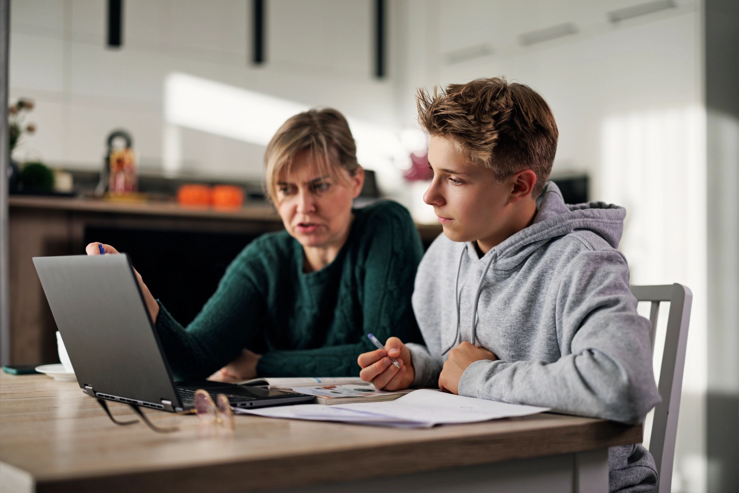 Parent supporting child during homework time