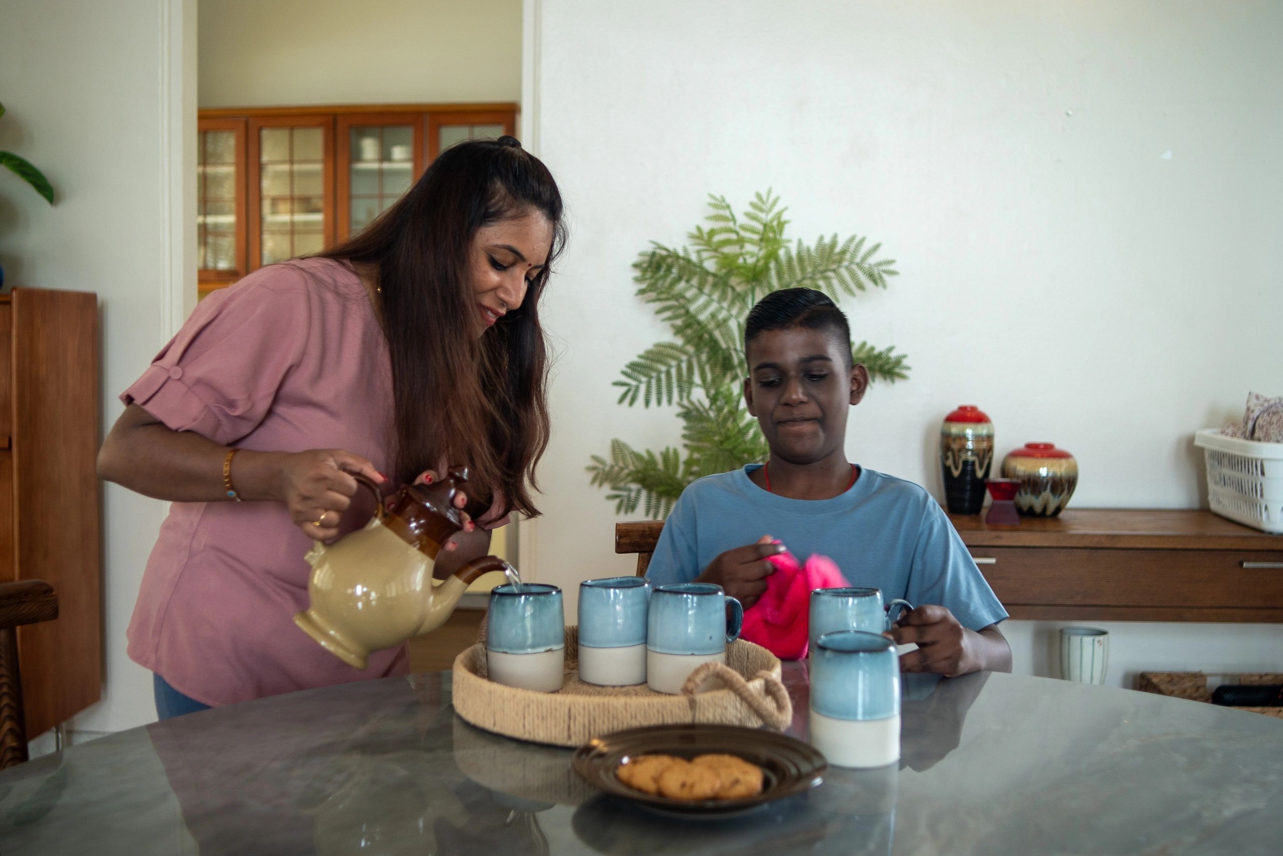 Mother and son learning together through household activity