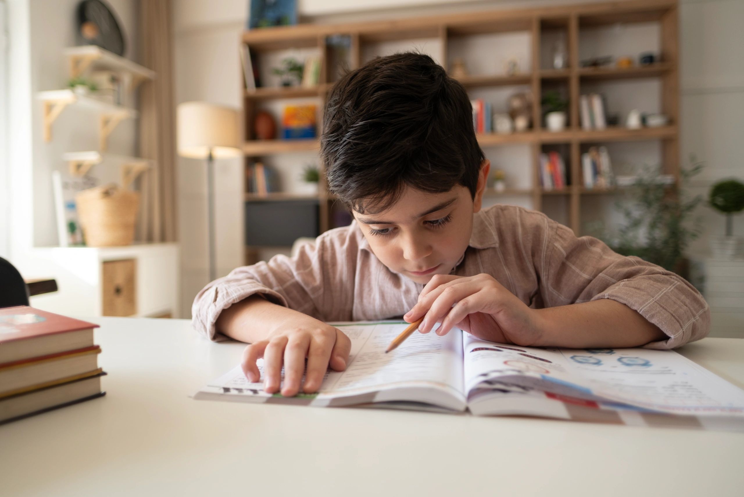 Student studying independently at home desk
