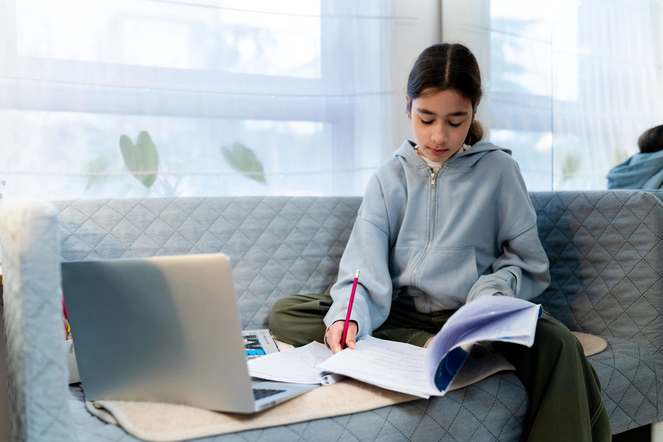 Student attending an online tuition session from home