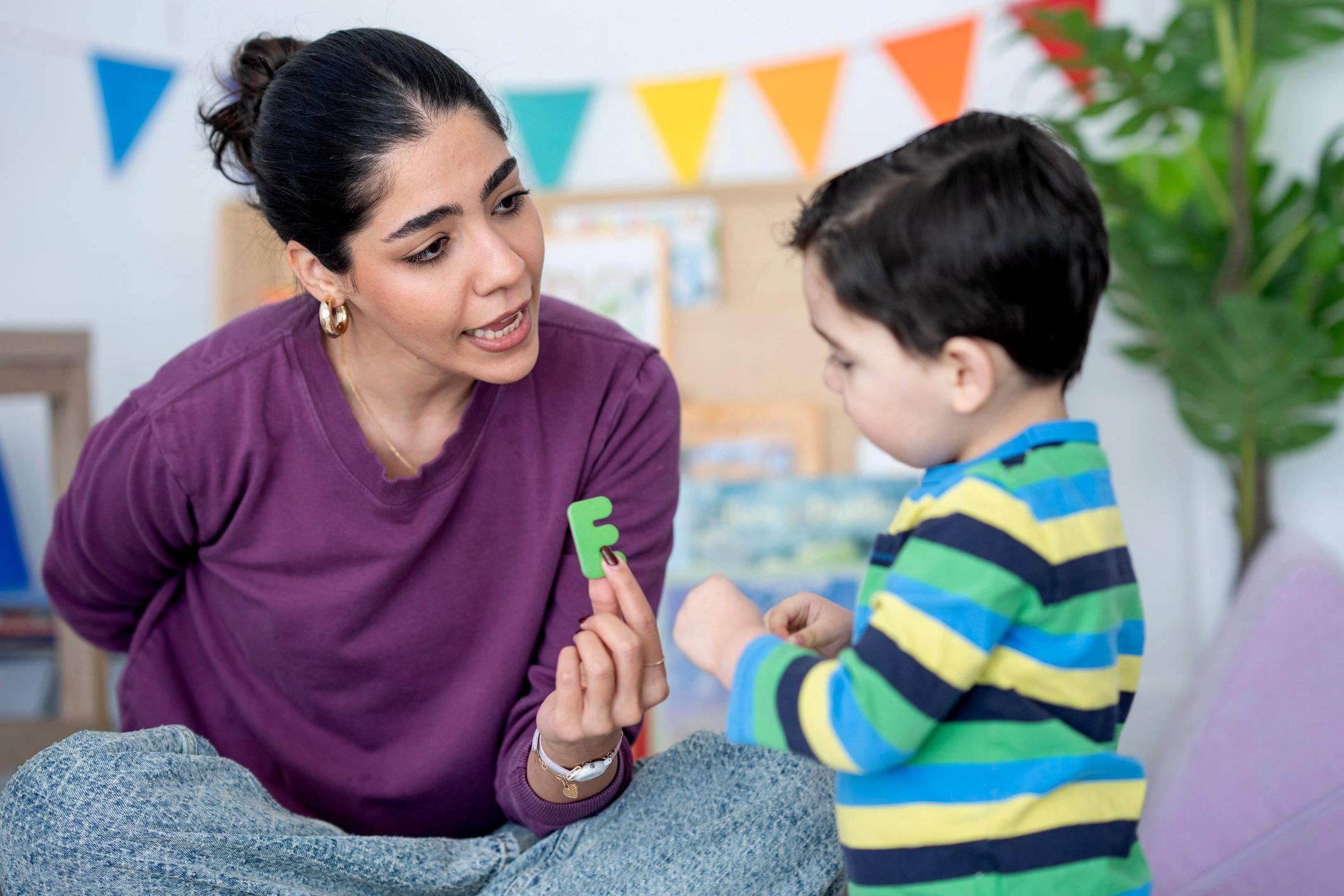Tutor working one-on-one with a young student at home