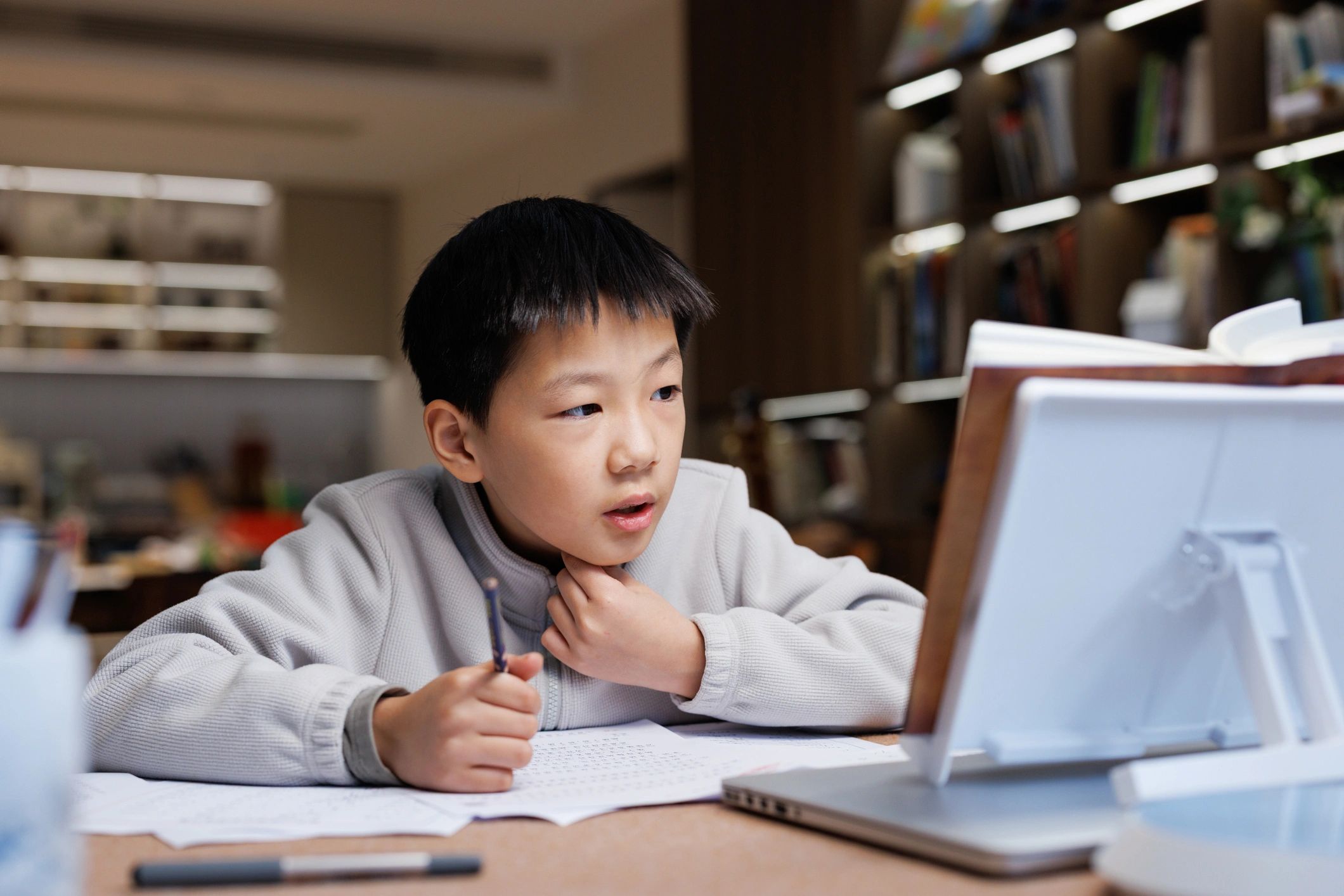 Student studying at home with notebook